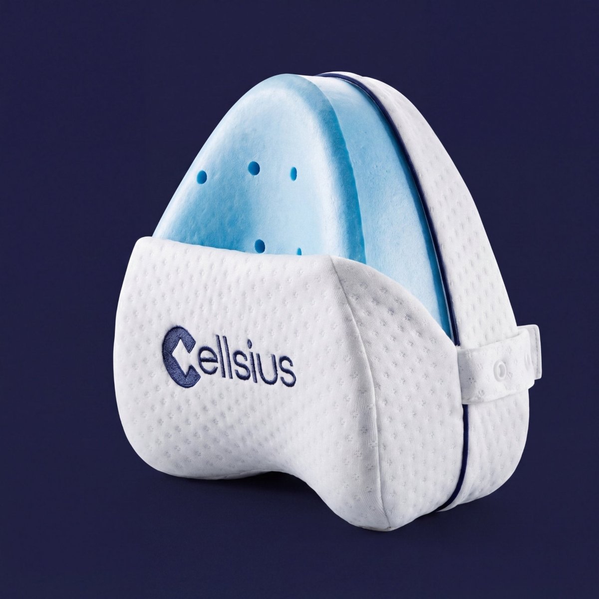 Le Coussin Genoux Cellsius : forme de cœur, mousse ferme, housse respirante et sangle réglable